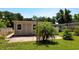 Backyard view of a home with a patio and green grass at 2812 Dawley Ave, Orlando, FL 32806