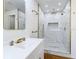 Close-up of bathroom with stylish vanity and a marble shower at 2812 Dawley Ave, Orlando, FL 32806