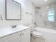 Modern bathroom featuring a vanity with sink, toilet and shower with decorative tile at 2812 Dawley Ave, Orlando, FL 32806