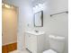 Bathroom with a vanity with sink, toilet and light fixture at 2812 Dawley Ave, Orlando, FL 32806