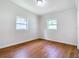 Bright bedroom featuring hardwood floors and two windows at 2812 Dawley Ave, Orlando, FL 32806