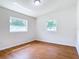 Cozy bedroom with wood floors and natural light from the windows at 2812 Dawley Ave, Orlando, FL 32806