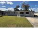 Charming single-story home with a well-manicured front lawn and inviting entrance at 2812 Dawley Ave, Orlando, FL 32806