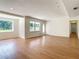 Bright living room with wood floors and large windows for plenty of natural light at 2812 Dawley Ave, Orlando, FL 32806