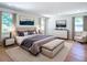 Bedroom with neutral tones, coordinated furniture, and natural light from two windows at 2812 Dawley Ave, Orlando, FL 32806