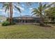 Spacious backyard featuring a pool and lush landscaping at 105 James Pond Ct, Debary, FL 32713