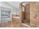 Primary bathroom with walk-in shower, soaking tub, and tiled floors at 105 James Pond Ct, Debary, FL 32713
