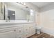 Bathroom with double vanity, tub and wood-look tile floor at 105 James Pond Ct, Debary, FL 32713