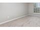 Well-lit bedroom showcasing neutral walls and carpeted floor at 105 James Pond Ct, Debary, FL 32713