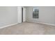 Cozy carpeted bedroom with a large closet and window with blinds at 105 James Pond Ct, Debary, FL 32713