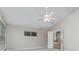 Primary bedroom with vaulted ceiling, ceiling fan and door to bathroom at 105 James Pond Ct, Debary, FL 32713