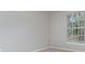 Bright bedroom featuring a large window and neutral decor at 105 James Pond Ct, Debary, FL 32713