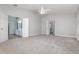 Large Primary bedroom with carpet, double doors to bathroom, and lots of natural light at 105 James Pond Ct, Debary, FL 32713