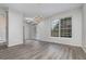 Bright dining room with chandelier and wood-look floors at 105 James Pond Ct, Debary, FL 32713