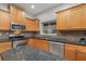Modern kitchen with stainless steel appliances and granite countertops at 105 James Pond Ct, Debary, FL 32713
