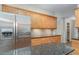 Modern kitchen with stainless steel appliances and granite countertops at 105 James Pond Ct, Debary, FL 32713