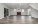 Spacious living room with fireplace, wood-look floors and sliding glass doors at 105 James Pond Ct, Debary, FL 32713