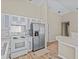 Well-lit kitchen with stainless steel appliances and a breakfast bar at 2977 Kokomo Loop, Haines City, FL 33844