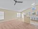 Bright and spacious living room featuring neutral walls and a large window at 2977 Kokomo Loop, Haines City, FL 33844