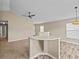 Open-concept floor plan with carpeted living area and view of a modern kitchen at 2977 Kokomo Loop, Haines City, FL 33844