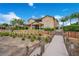 Walkway to the lake from a two-story home's backyard at 4118 Isle Vista Ave, Belle Isle, FL 32812
