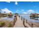 Expansive wooden dock leads to covered boat slips on the lake at 4118 Isle Vista Ave, Belle Isle, FL 32812