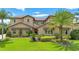 Two-story house with manicured lawn and palm trees at 4118 Isle Vista Ave, Belle Isle, FL 32812