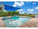 Resort-style pool with spa and fire pit feature at 4118 Isle Vista Ave, Belle Isle, FL 32812