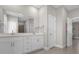 Double vanity bathroom with modern white cabinets at 325 Daffodil Ln, Kissimmee, FL 34759