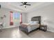 Bright bedroom with ceiling fan and large windows at 325 Daffodil Ln, Kissimmee, FL 34759
