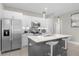 Modern kitchen with stainless steel appliances and a large island at 325 Daffodil Ln, Kissimmee, FL 34759