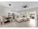 Open living room and kitchen with modern appliances and spacious island at 325 Daffodil Ln, Kissimmee, FL 34759