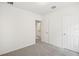 Bedroom features neutral carpet and light-colored walls at 507 Kennedy Dr, Lake Alfred, FL 33850