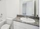 Bathroom features single sink, granite counters, and white cabinets at 510 Kennedy Dr, Lake Alfred, FL 33850