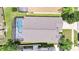 Aerial view of the property featuring a sparkling pool, screened patio, and well-maintained landscaping at 16608 Rising Star Dr, Clermont, FL 34714