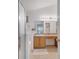 Well-lit bathroom with a vanity, tub and shower combination and tile flooring at 16608 Rising Star Dr, Clermont, FL 34714