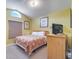 Cozy bedroom featuring neutral decor and a large window letting in natural light at 16608 Rising Star Dr, Clermont, FL 34714