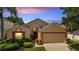 Inviting single-Gathering home with a well-manicured lawn and a two-car garage at 16608 Rising Star Dr, Clermont, FL 34714