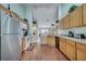 Bright kitchen featuring stainless steel appliances, wood cabinets and flooring at 16608 Rising Star Dr, Clermont, FL 34714