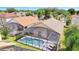 Aerial view of screened-in pool with lounge chairs, perfect for outdoor relaxation at 16608 Rising Star Dr, Clermont, FL 34714