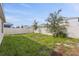 Small grassy backyard with trees at 2321 Tay Wes Dr, Saint Cloud, FL 34771