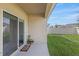 Small patio with sliding glass door at 2321 Tay Wes Dr, Saint Cloud, FL 34771