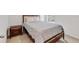 Bright bedroom with double bed and nightstand at 2321 Tay Wes Dr, Saint Cloud, FL 34771