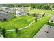 Aerial view of a neighborhood park with a playground and walking path at 2321 Tay Wes Dr, Saint Cloud, FL 34771