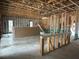 Unfinished basement with framing, stairs, and plumbing rough-in at 1633 Illinois St, Orlando, FL 32803