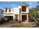 Two-story house under construction, showing framing and exterior walls at 1633 Illinois St, Orlando, FL 32803