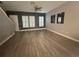 Bright living room with hardwood floors, plantation shutters, and neutral walls at 3136 Porta Romano Way, Lake Mary, FL 32746