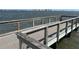 Pier with treated wood construction, wire rope railing and non-slip walking surface overlooking the water at 1801 James St, South Daytona, FL 32119