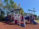 A colorful playground offers slides, climbing structures, and engaging activities for children in a safe and fun environment at 1801 James St, South Daytona, FL 32119