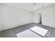 Bright and spacious carpeted bedroom with a ceiling fan and ample light at 1078 Osprey Cove Cir, Groveland, FL 34736